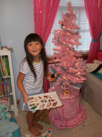 Kasen decorating her pink tree